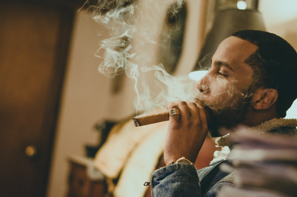 man smoking a cigar