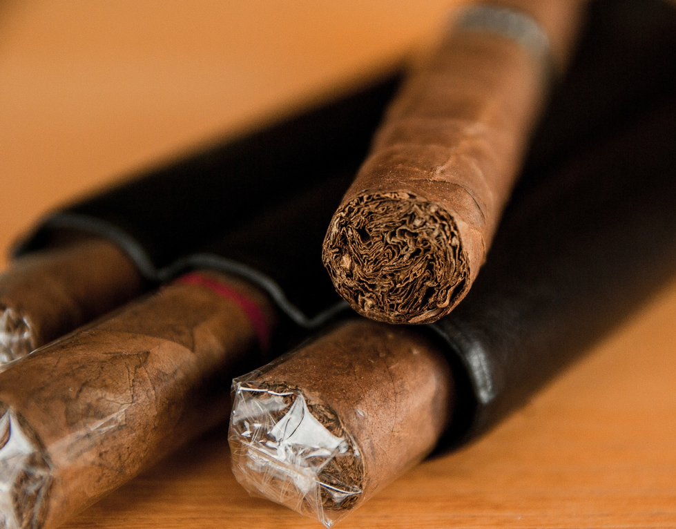 Cigars wrapped in plastic in tubes