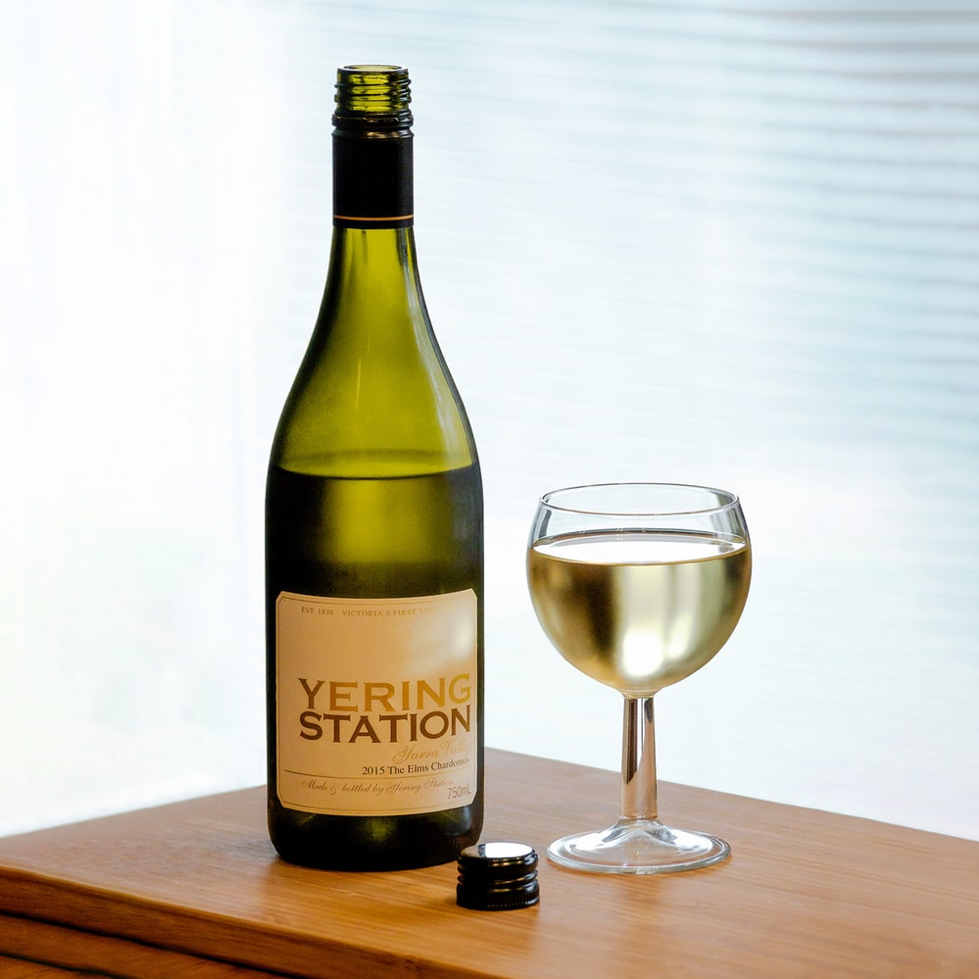 bottle of white wine with a glass of white wine