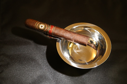 A semi box-pressed cigar on an ashtray