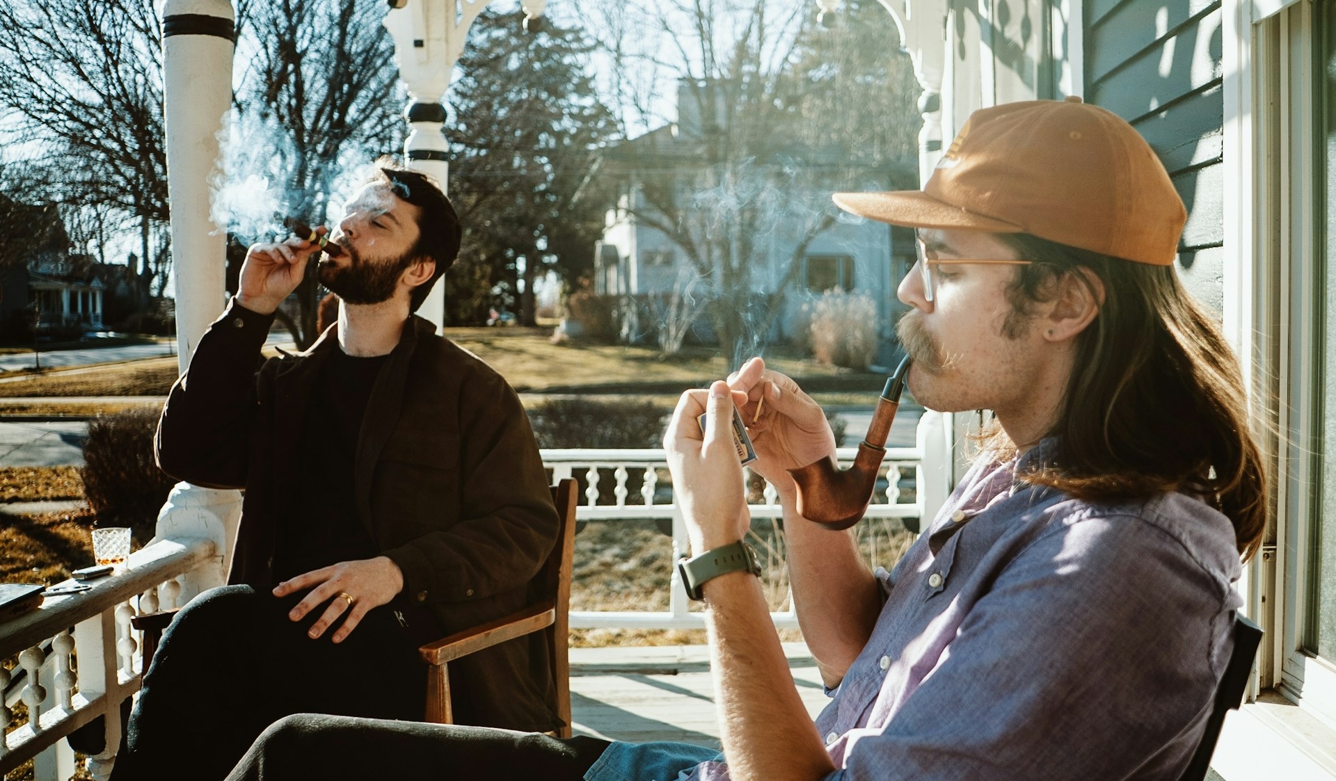 men smoking a cigar and a pipe