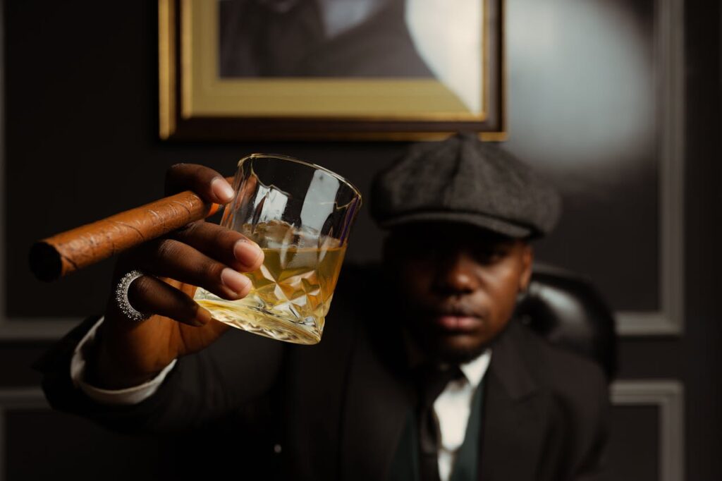 man with whisky and a cigar