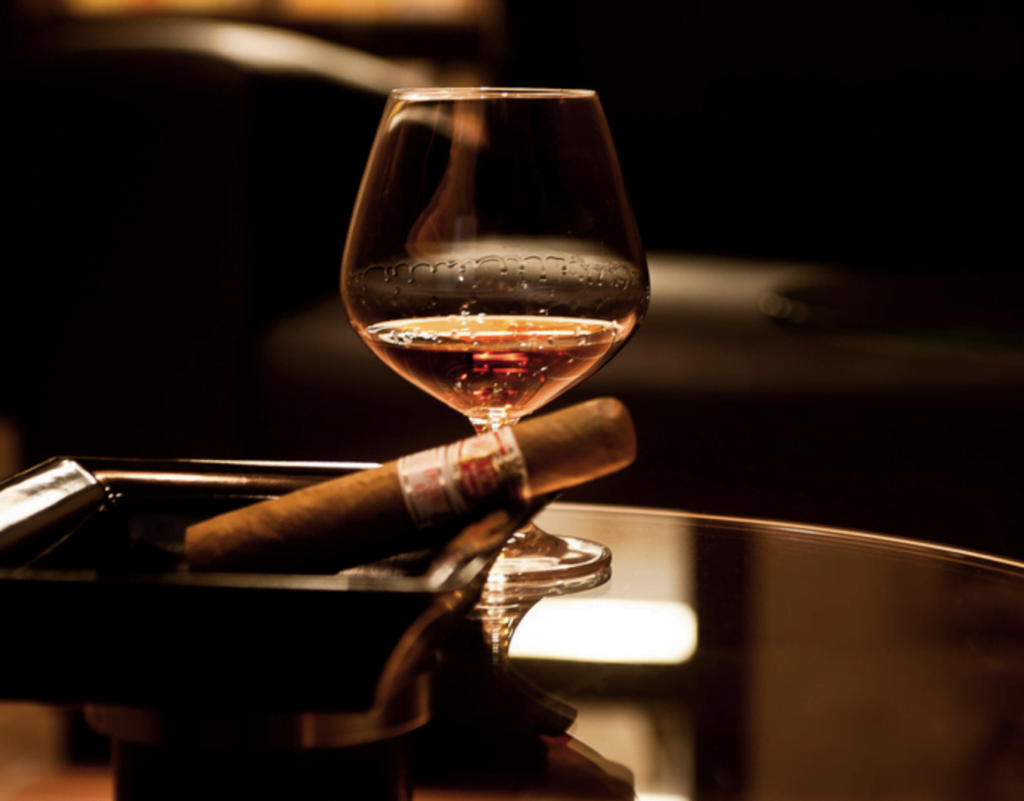 Cigar and cognac on table