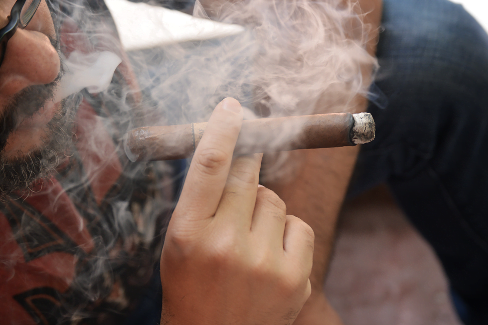 Smoke sifting through the air on a black background.