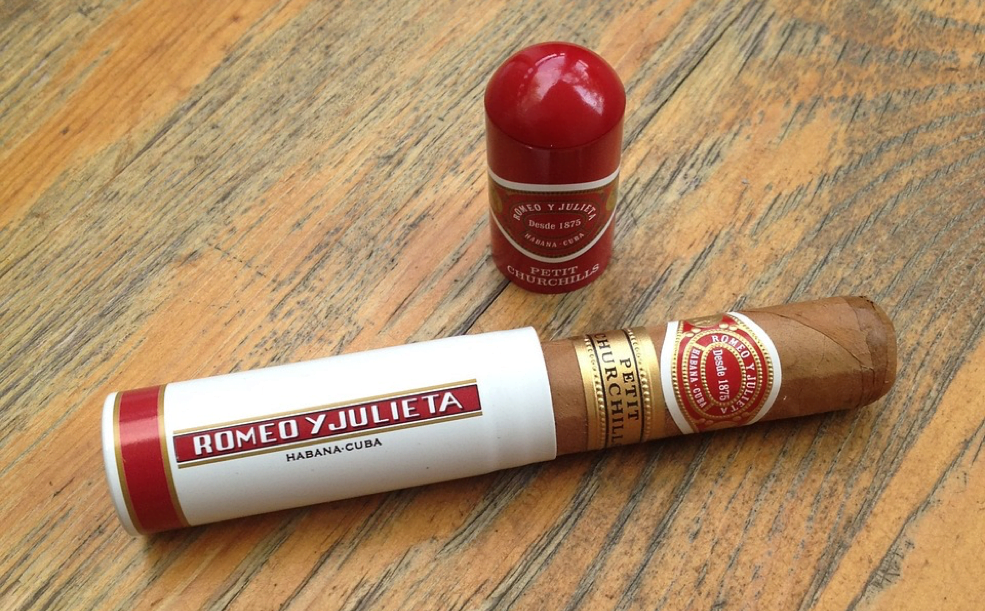 A tubed cigar out of a humidor