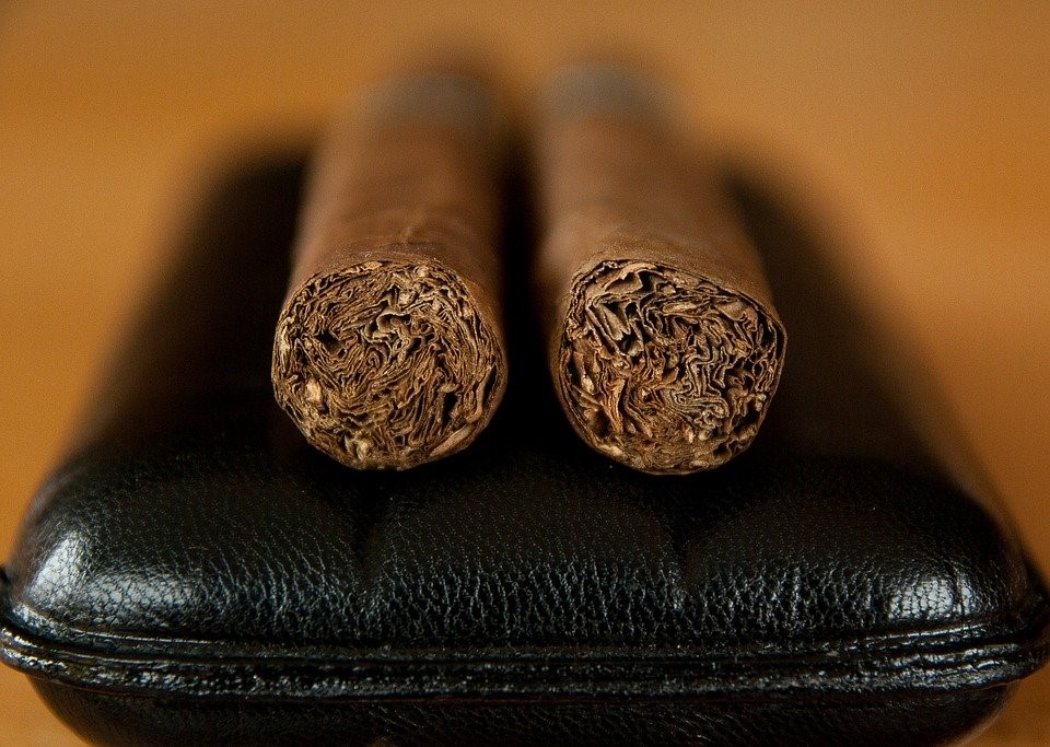 cigars on a leather case