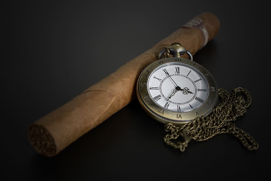 a cigar with a watch