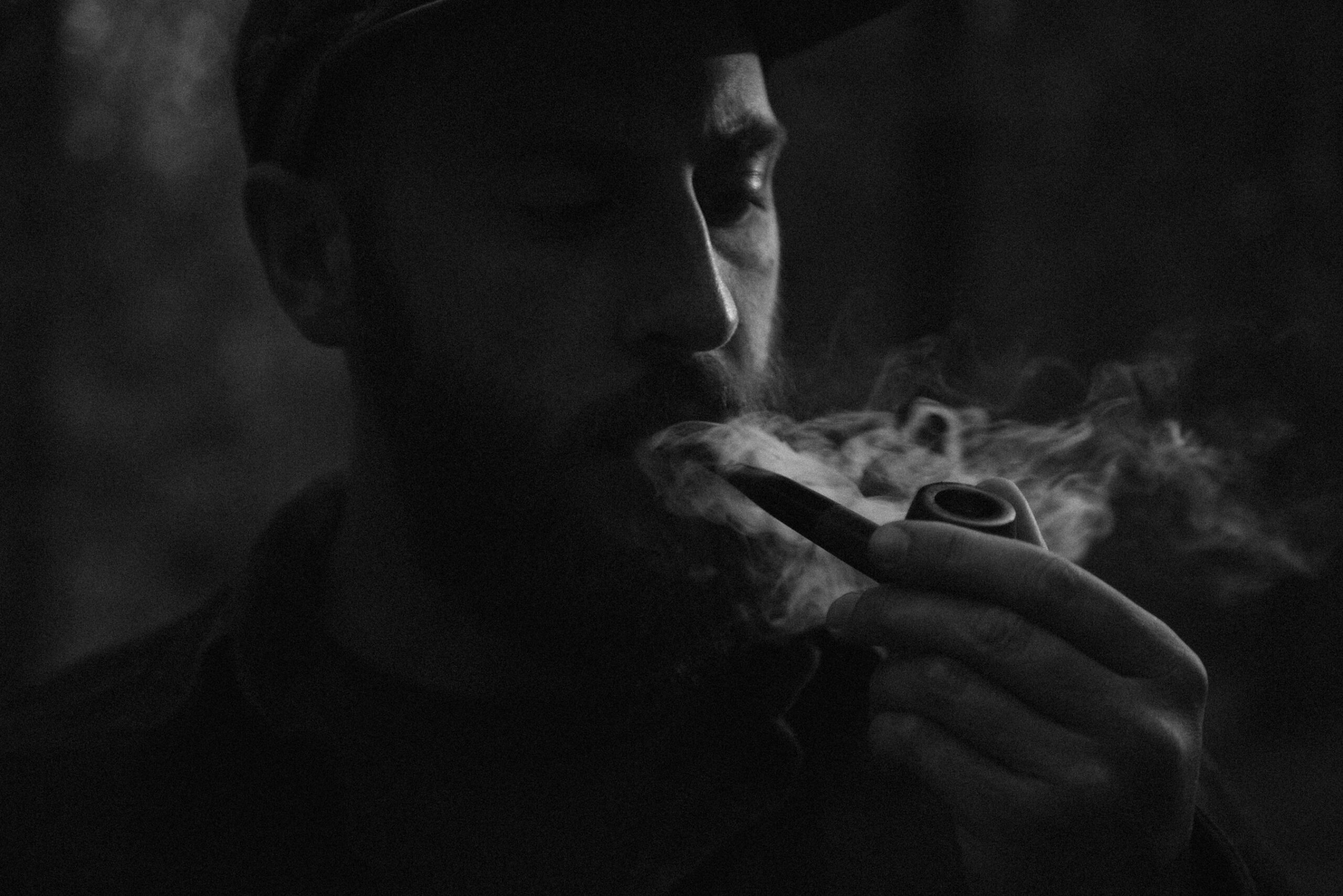 man smoking a pipe