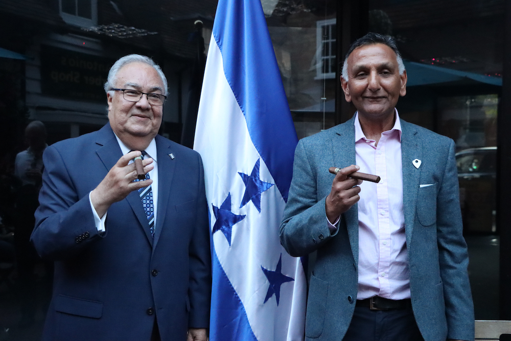 Ambassador of Honduras, H.E. Iván Romero Martínez and Paresh Patel holding cigars