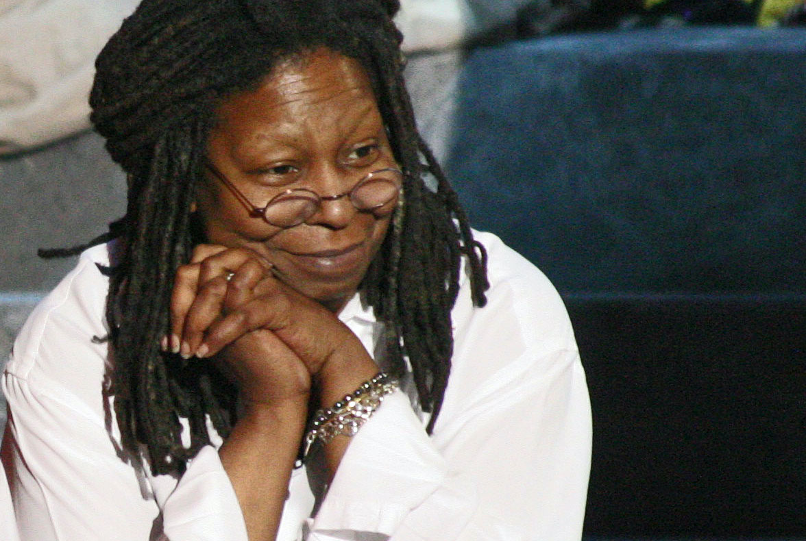 Whoopi Goldberg smiling on stage