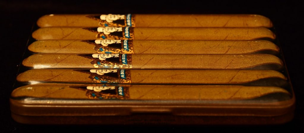 Tin of full of identical cigars 