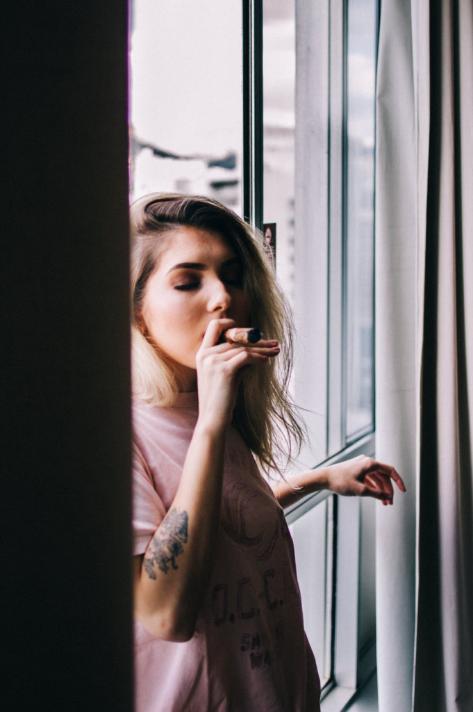 woman smoking a cigar