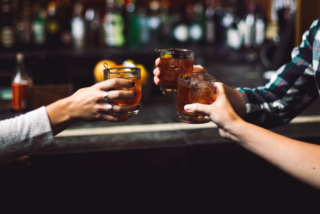Three friends drinking whisky