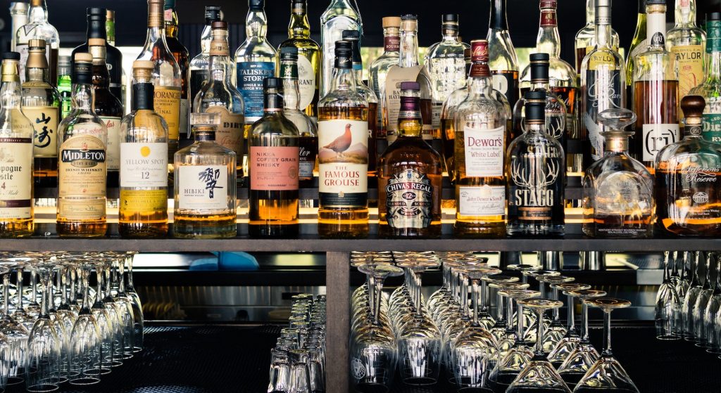 Collection of whisky behind a bar